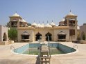 Swimming pool, palace in background